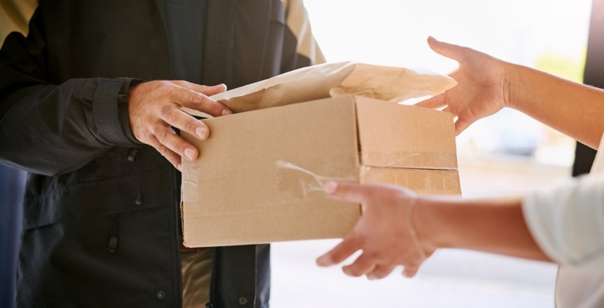 Courier delivering parcel